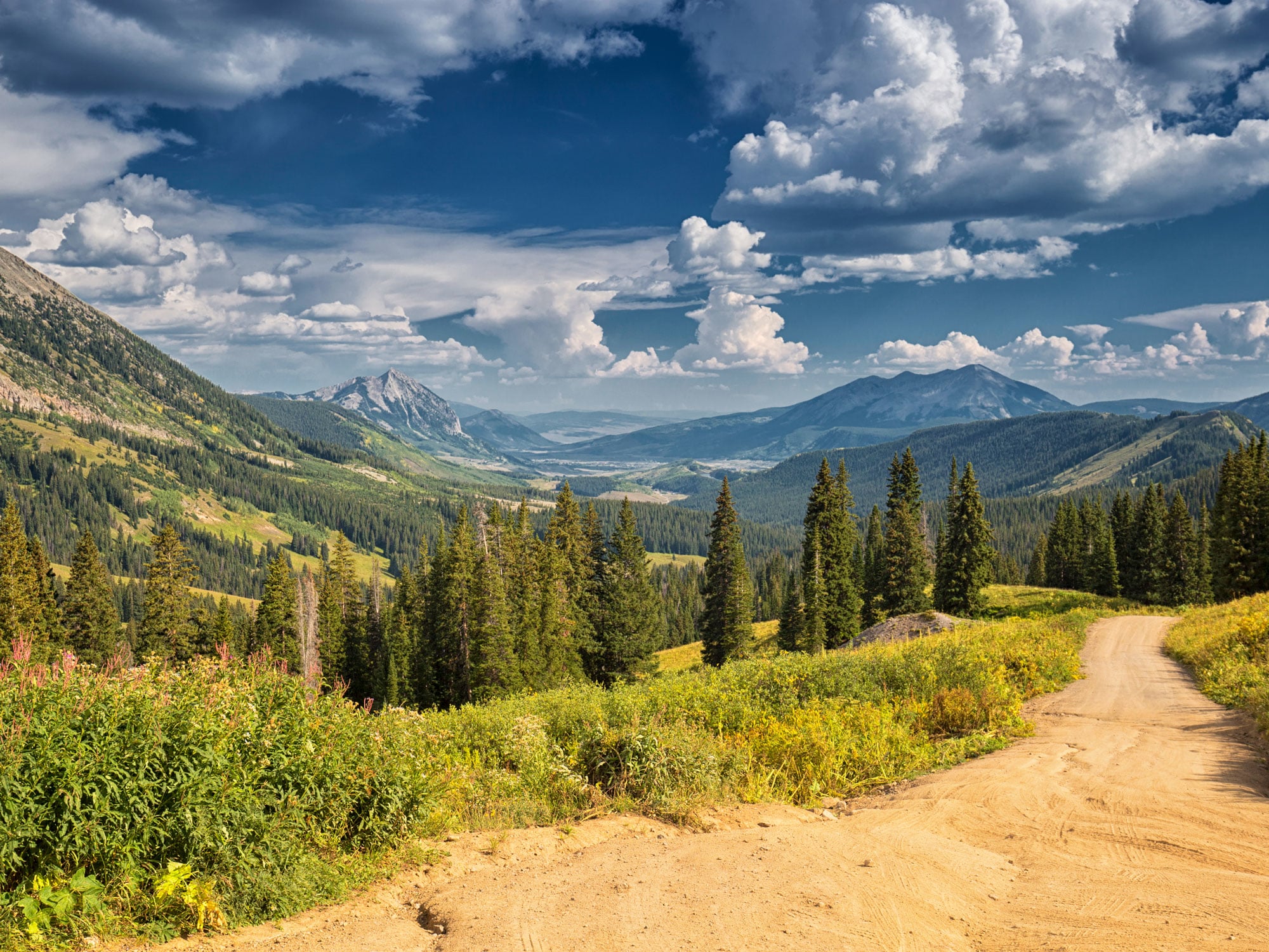 Dirt path through mountainous landscape of Colorado