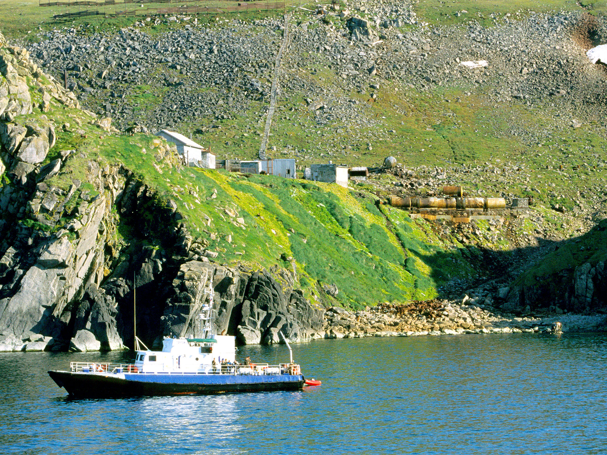 Boat along coast of Big Diomede Island, Russia