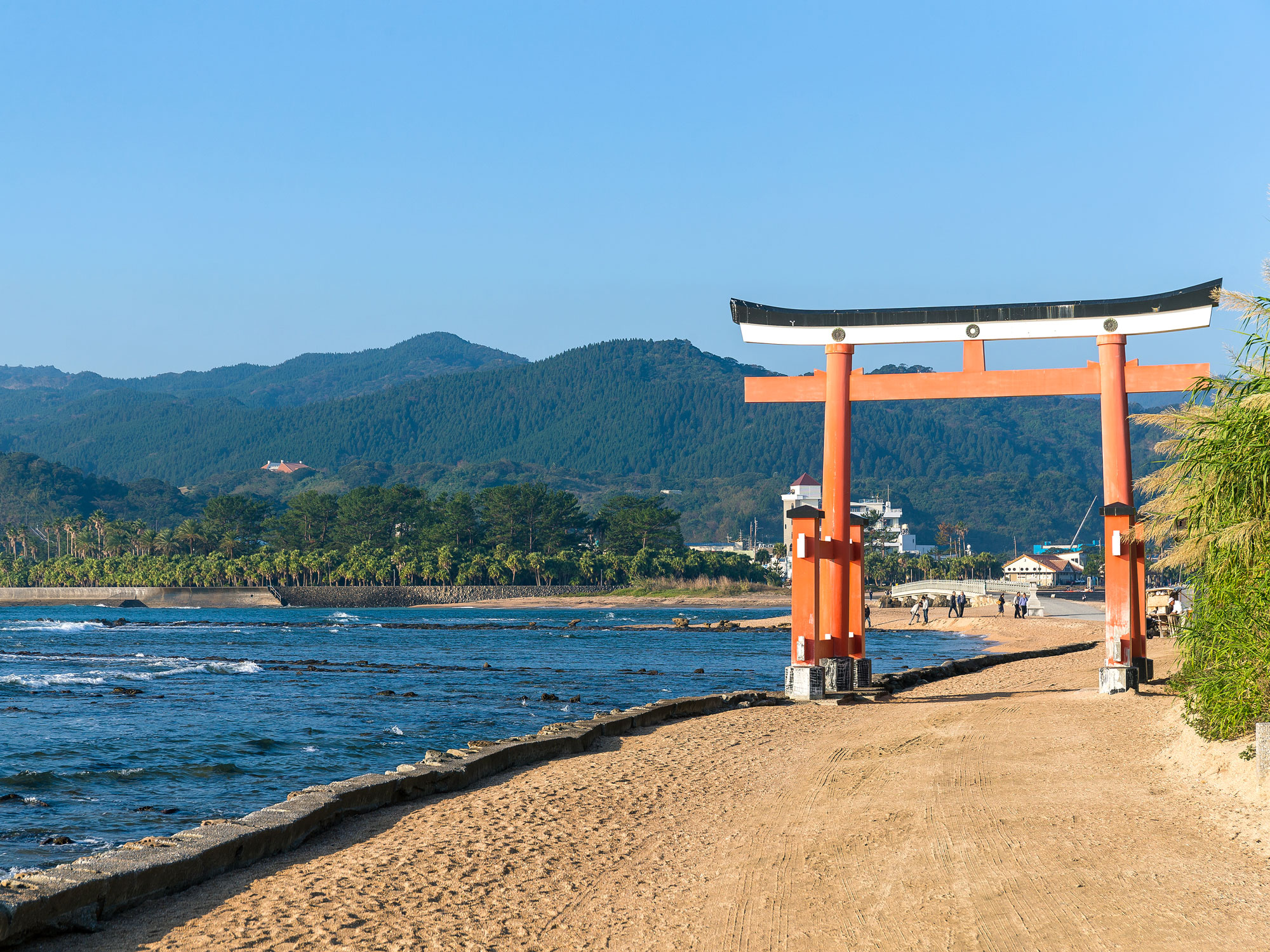 Traditional orange Japanese temple gate on Aoshima Island in Japan