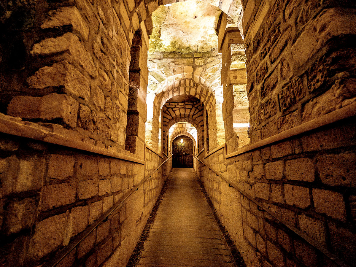 Underground walkway inside Catacombs of Paris