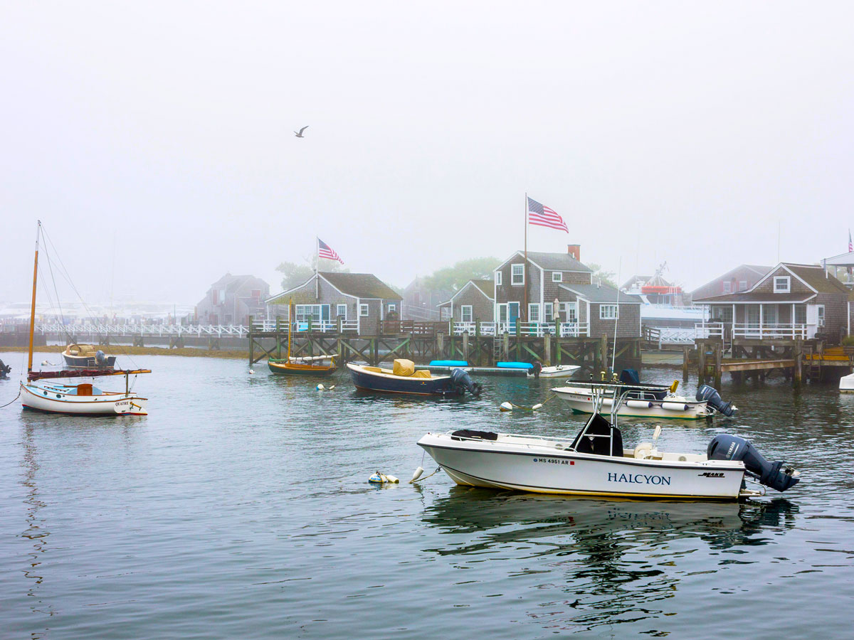 Boats in fog-shrouded harbor of Nantucket, Massachusetts
