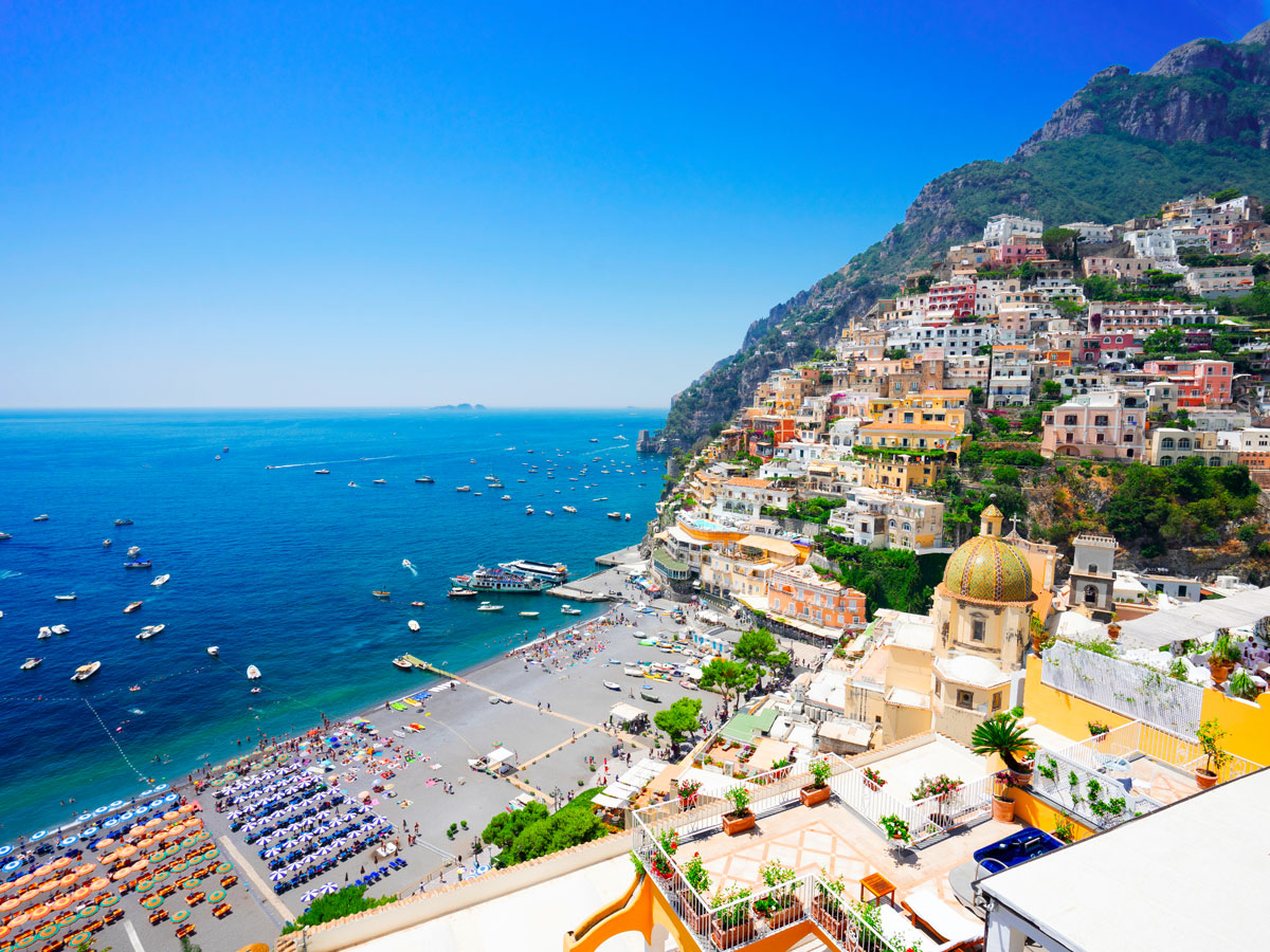Colorful homes stacked on hillside overlooking the Amalfi Coast in Italy