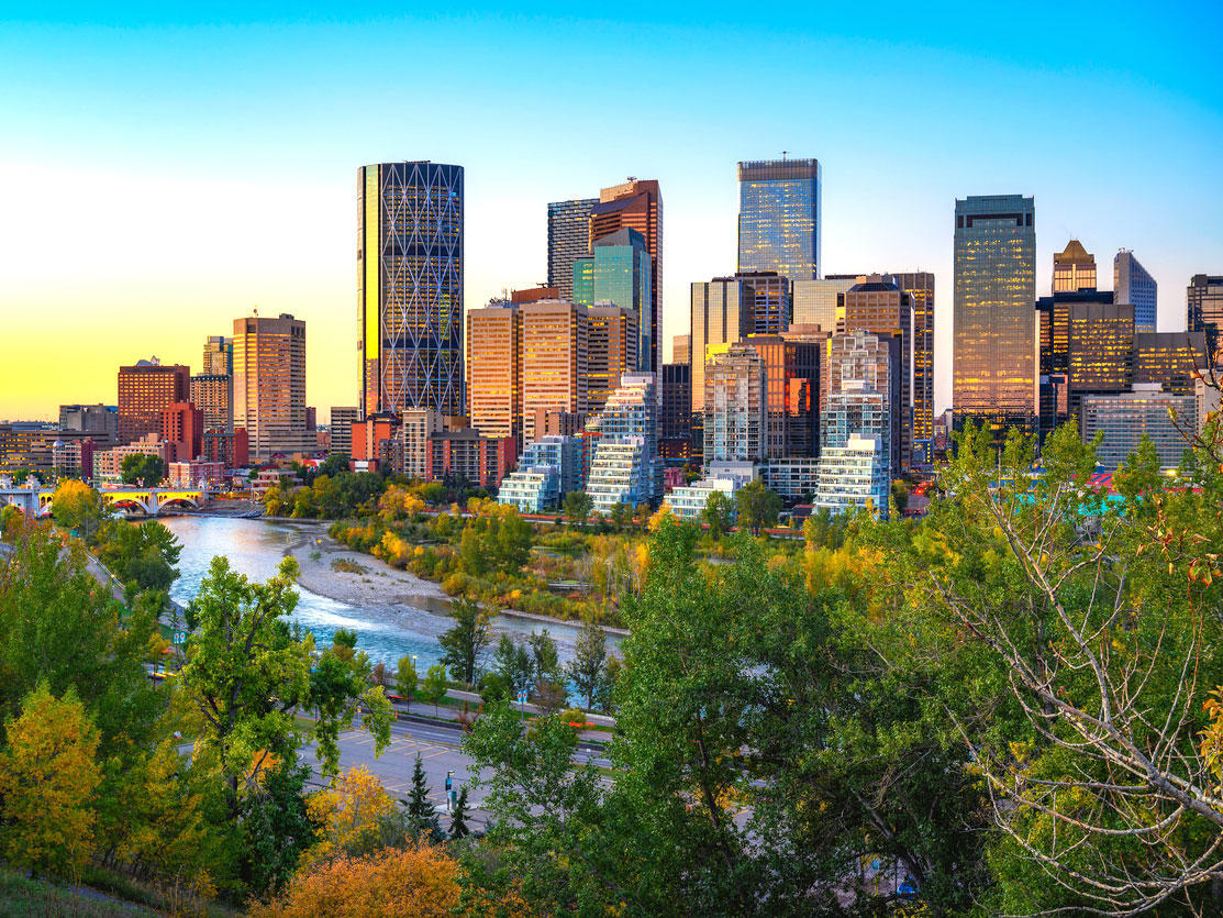 Sunset above Bow River and Calgary skyline in Alberta, Canada