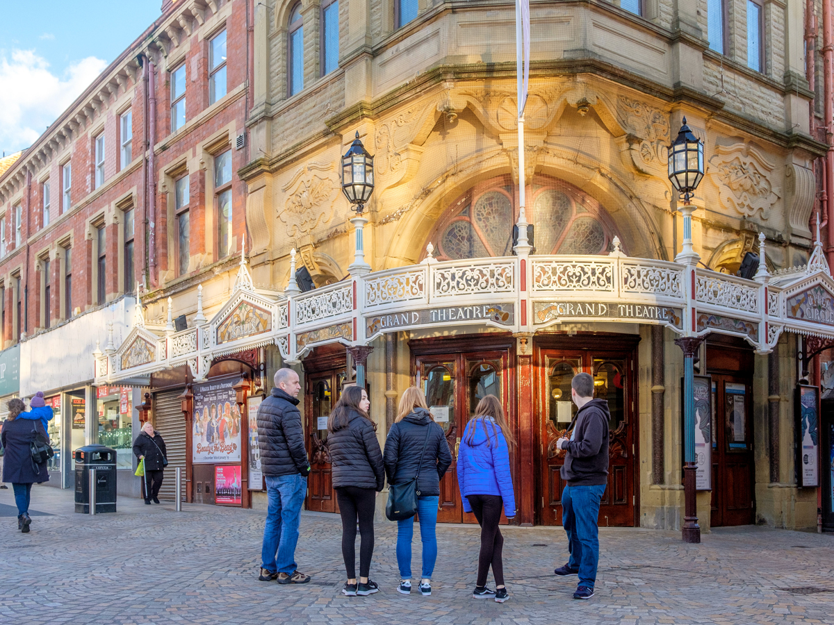 Onlookers outside the historic Grand Theatre in Blackpool, England