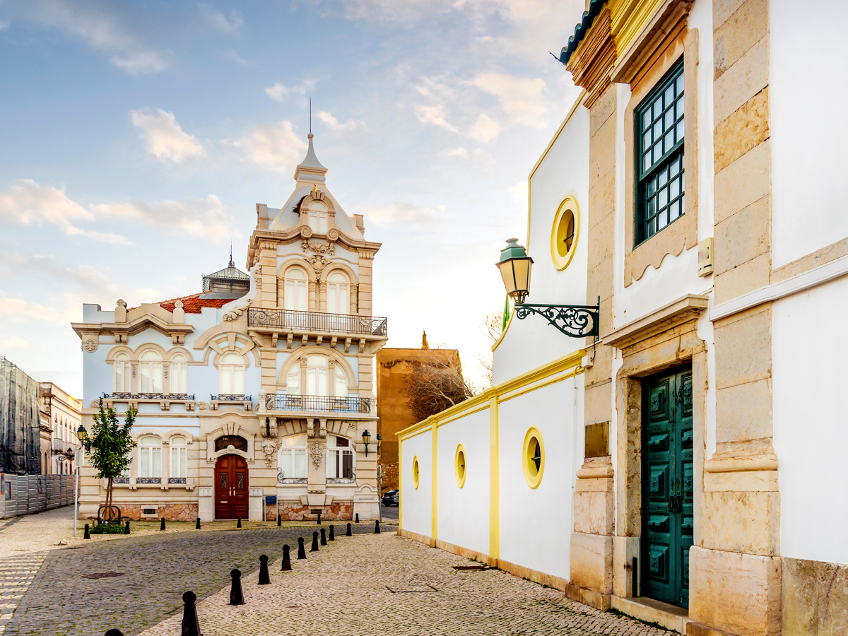 Church and cobblestone streets in Faro, Portugal