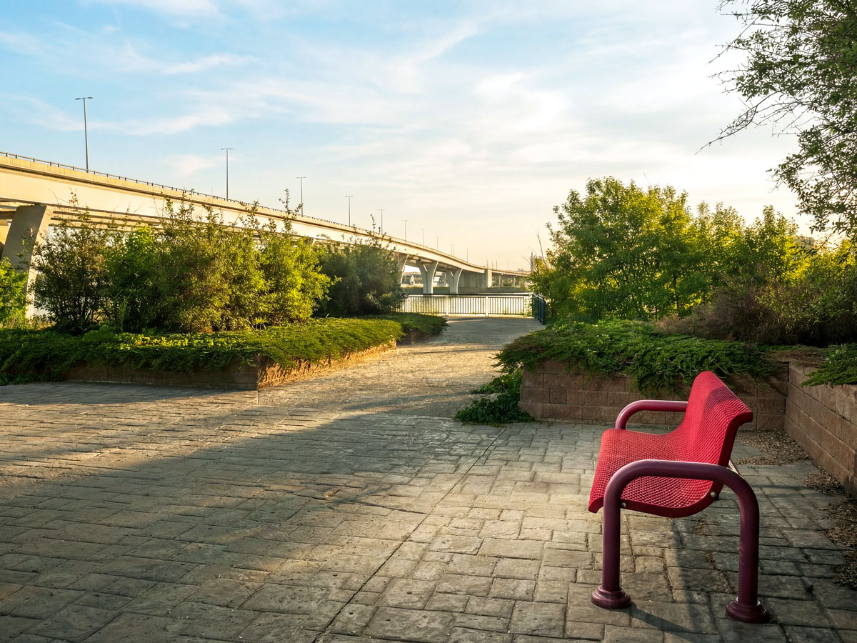 Park bench beside bridge in Bismarck, North Dakota