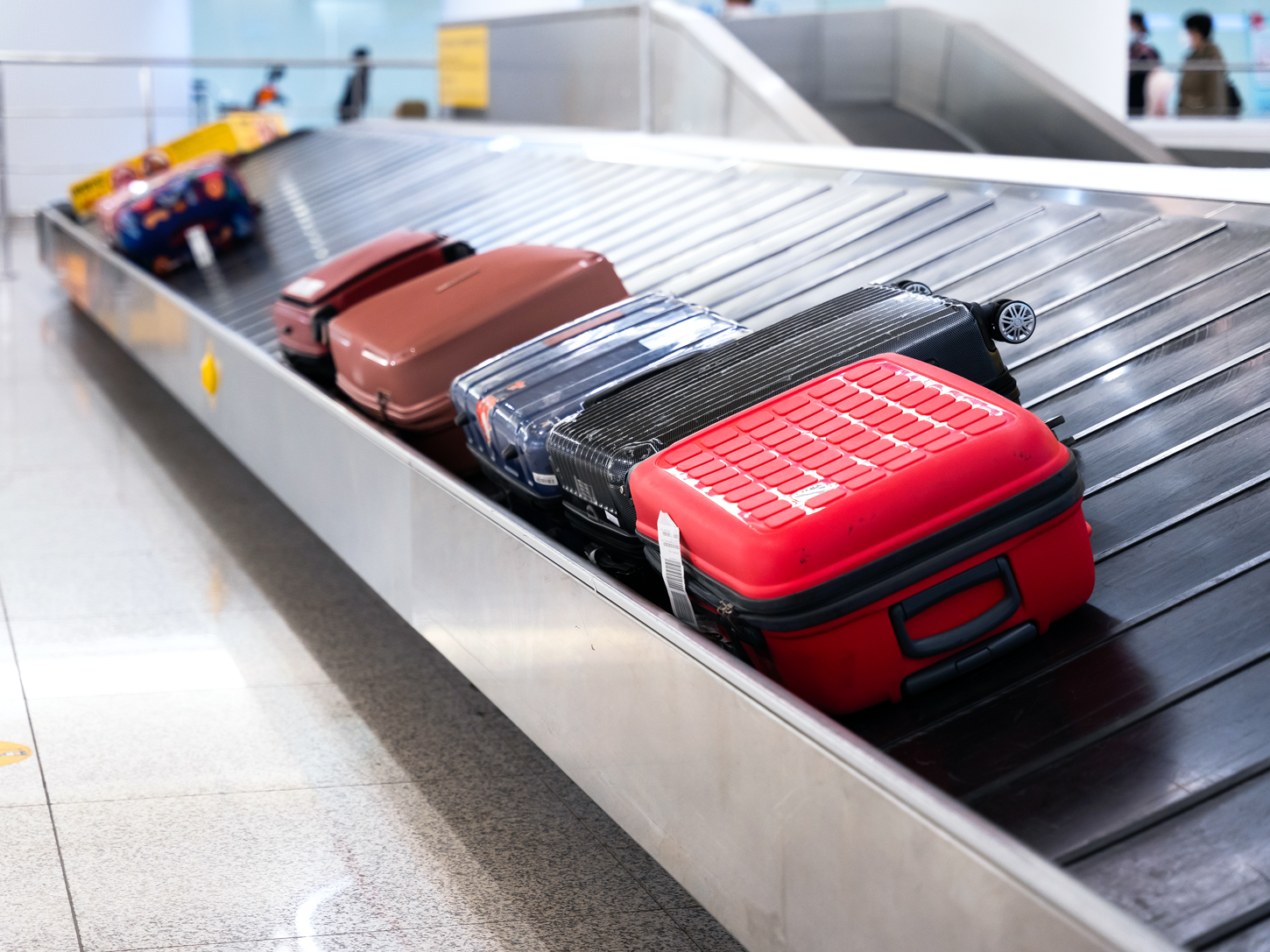 Baggage arriving on airport carousel