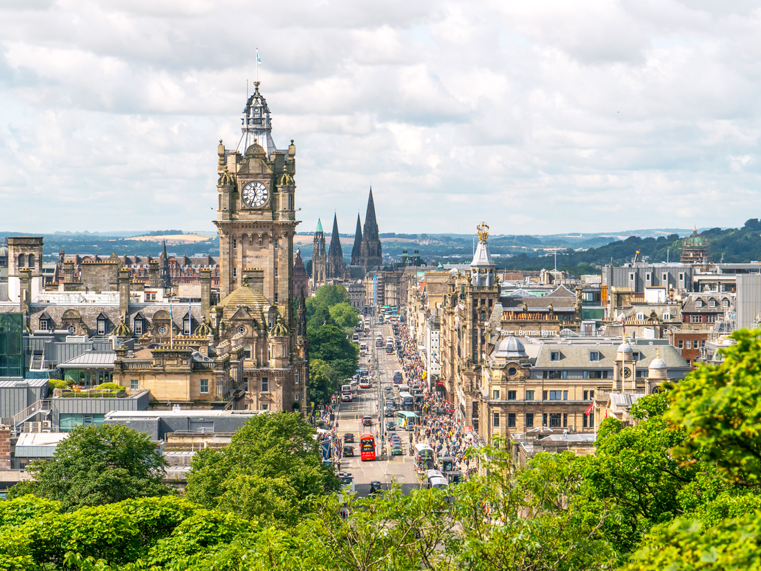 Clock tower above skyline of Edinburgh, Scotland