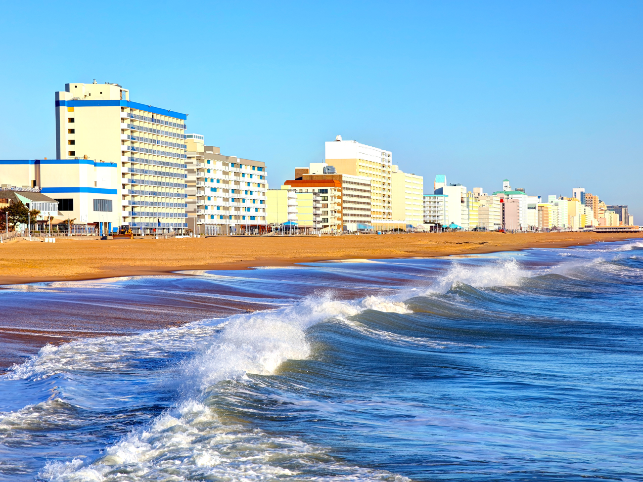 Waves crashing beside Virginia Beach boardwalk