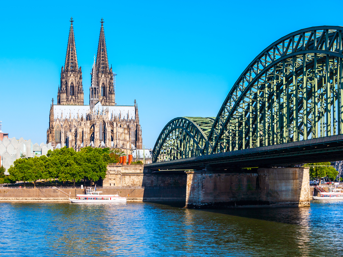 Bridge across Rhine River with view of Cologne Cathedral in Cologne, Germany