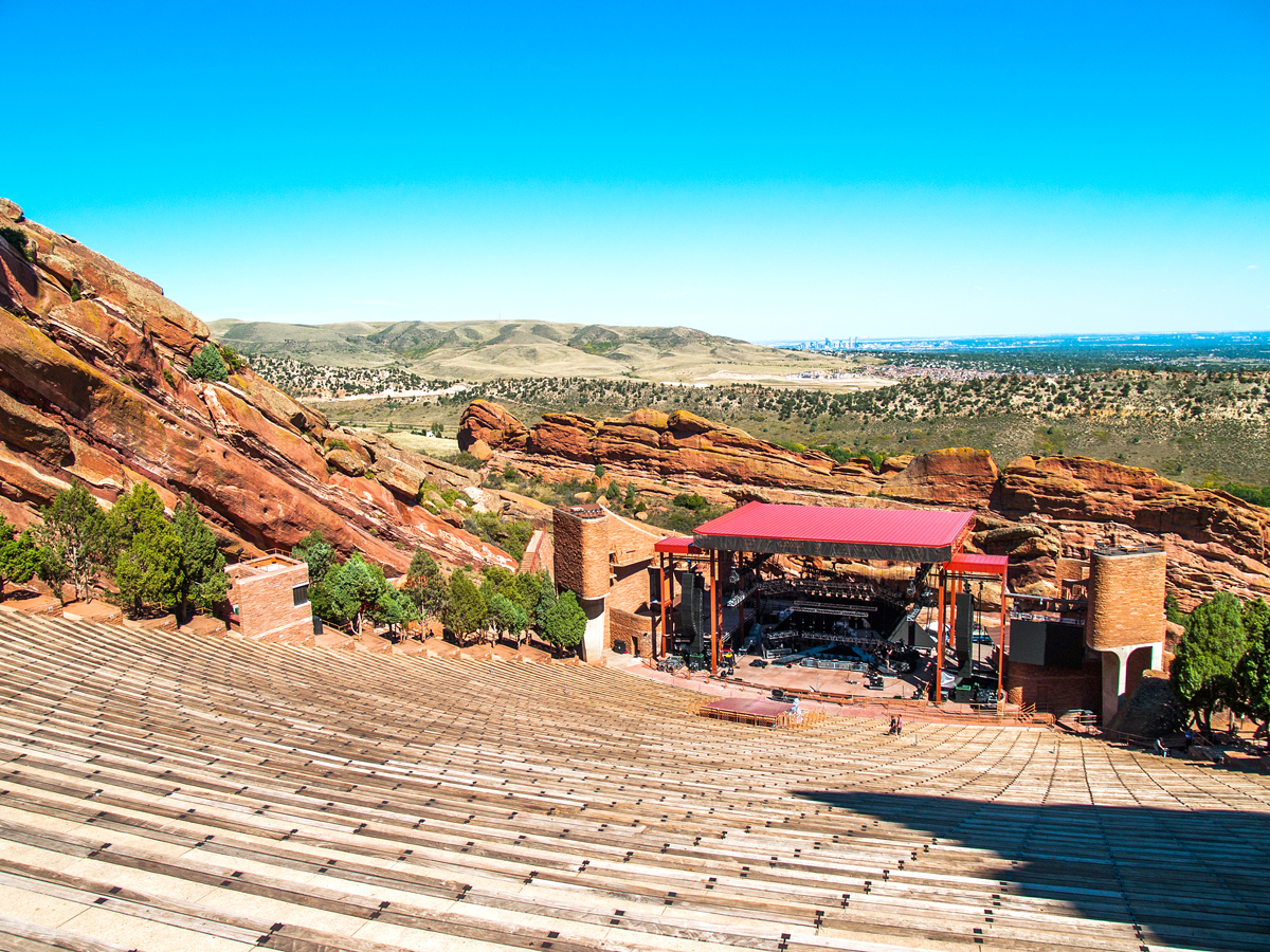 View of stage and surrounded mountains from top level of Red Rocks Amphitheatre in Colorado