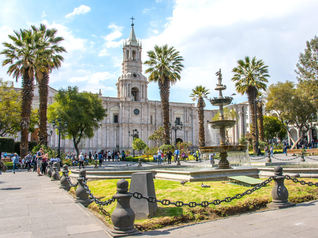 People gathering in Plaza de Armas in front of Cathedral Basilica of Arequipa, Peru