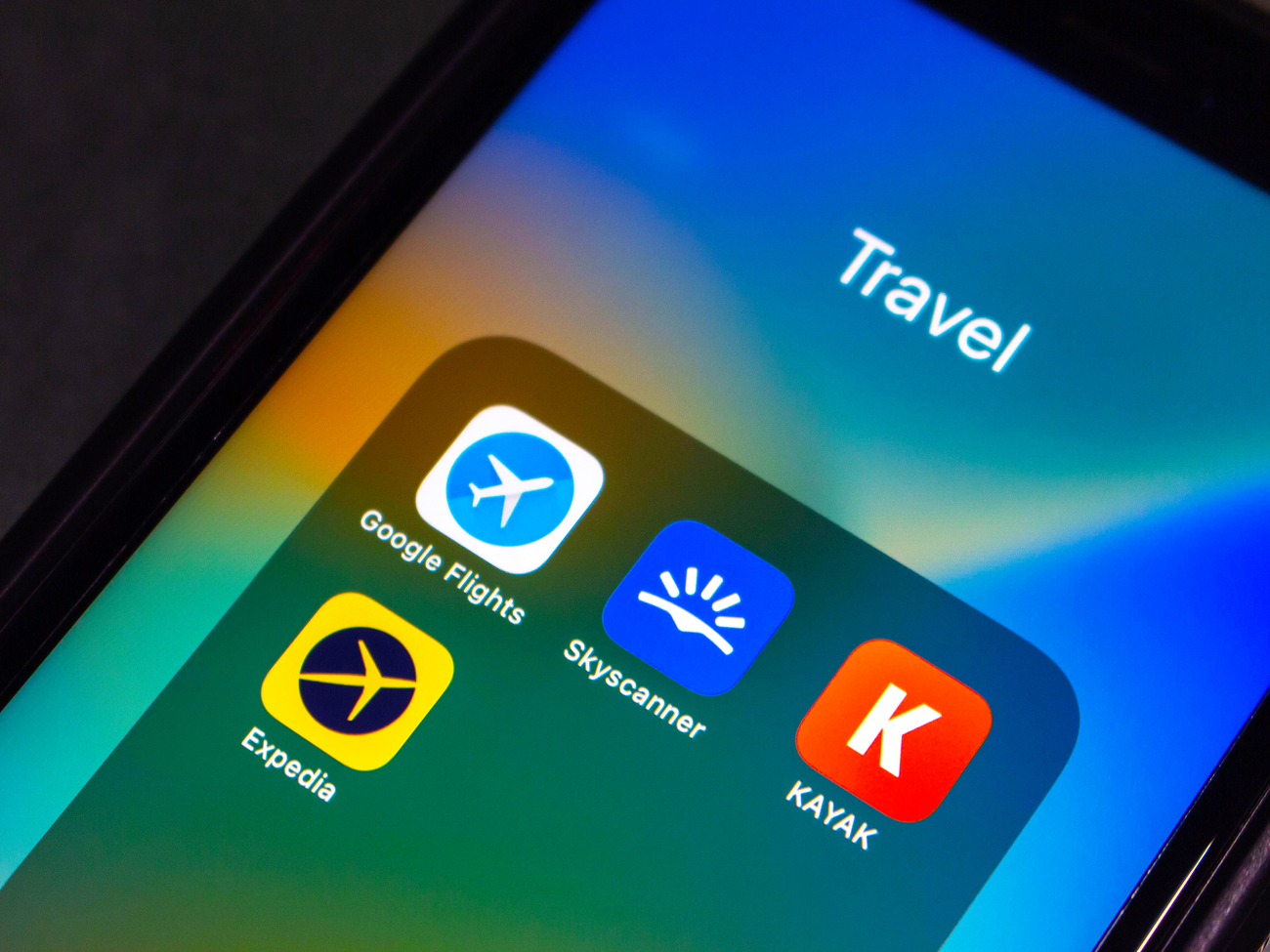 Close-up of smartphone travel app folder