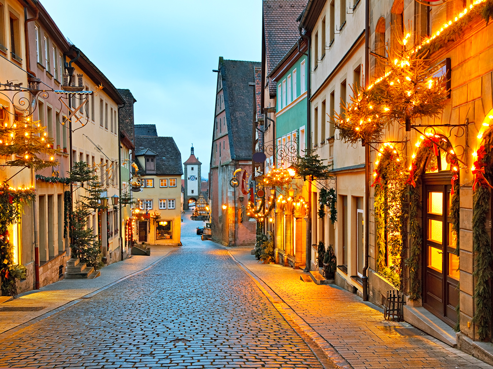 Cobblestone street in Rothenburg ob der Tauber, Germany, decorated for Christmas