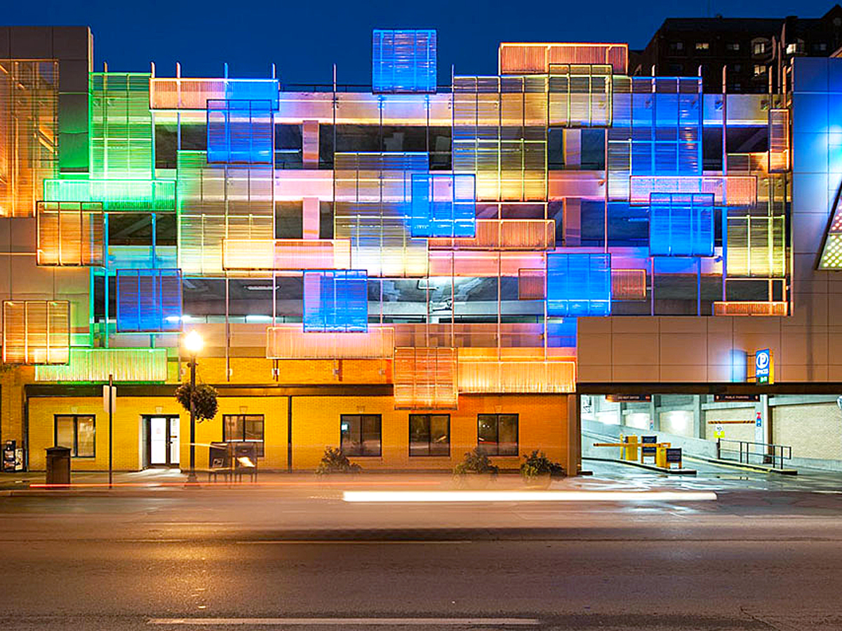 Multi-colored lights illuminating the Helix Garage in Lexington, Kentucky