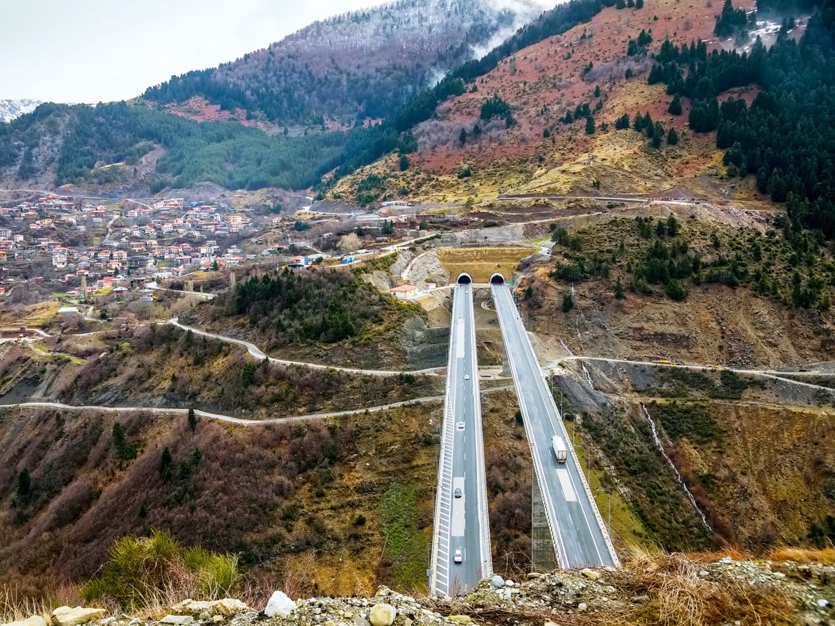 Aerial view of the Egnatia Odos Motorway with tunnel entering mountain in Greece