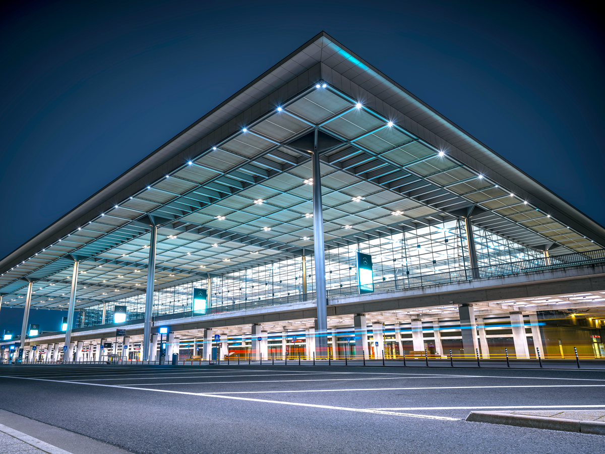 Terminal building at Berlin Brandenburg Airport illuminated at night