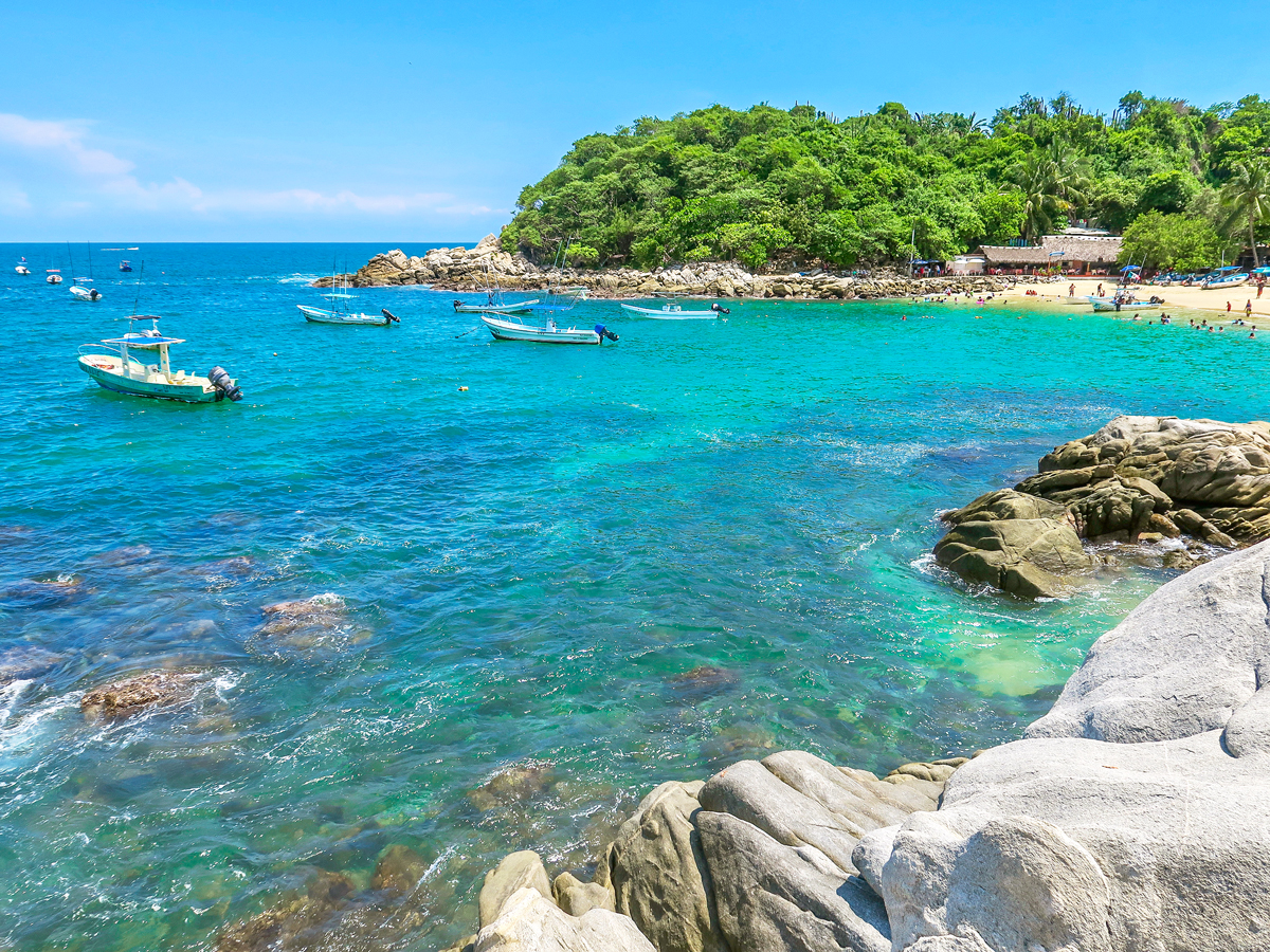 Boats in bay off coast of Puerto Escondido, Mexico