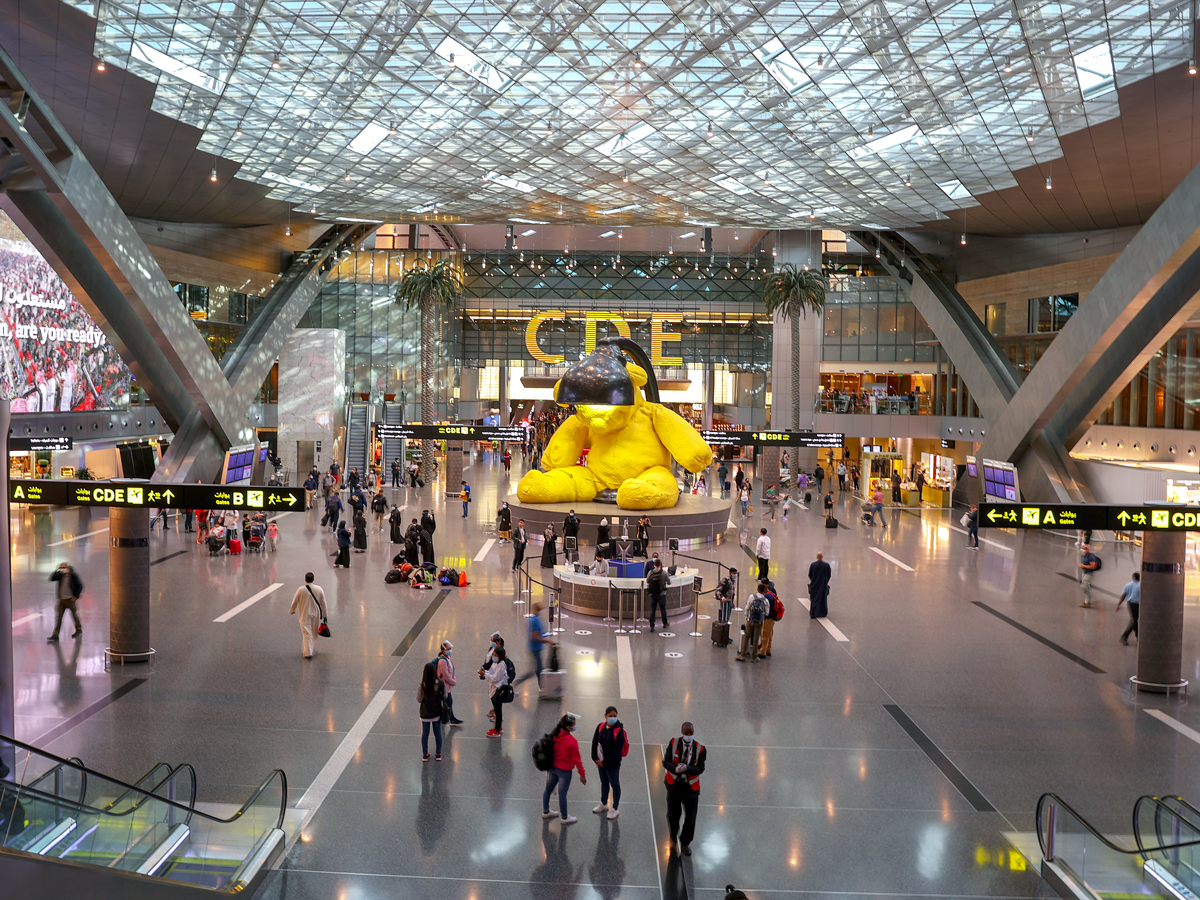 Passengers walking through Doha Hamad International Airport in Qatar
