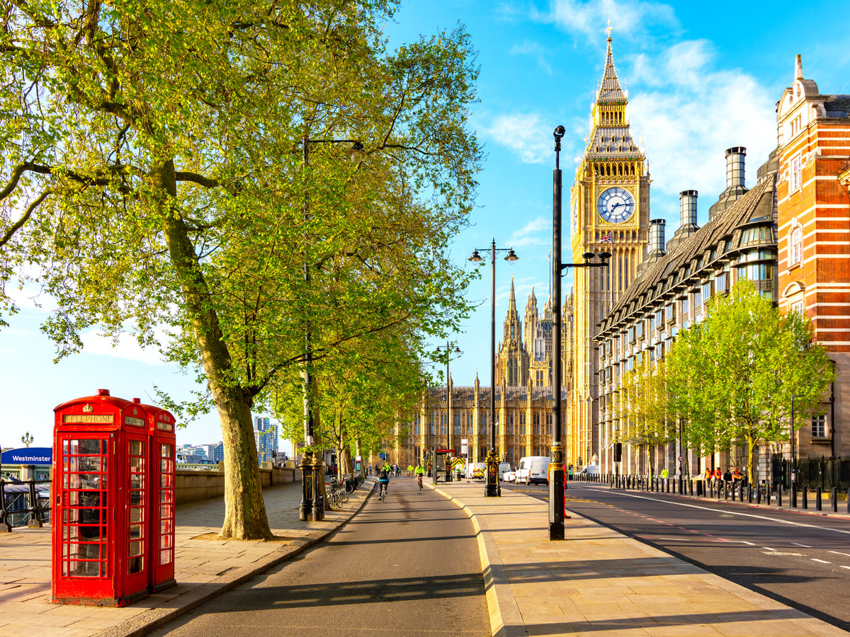Red telephone booth near Big Ben in London, England