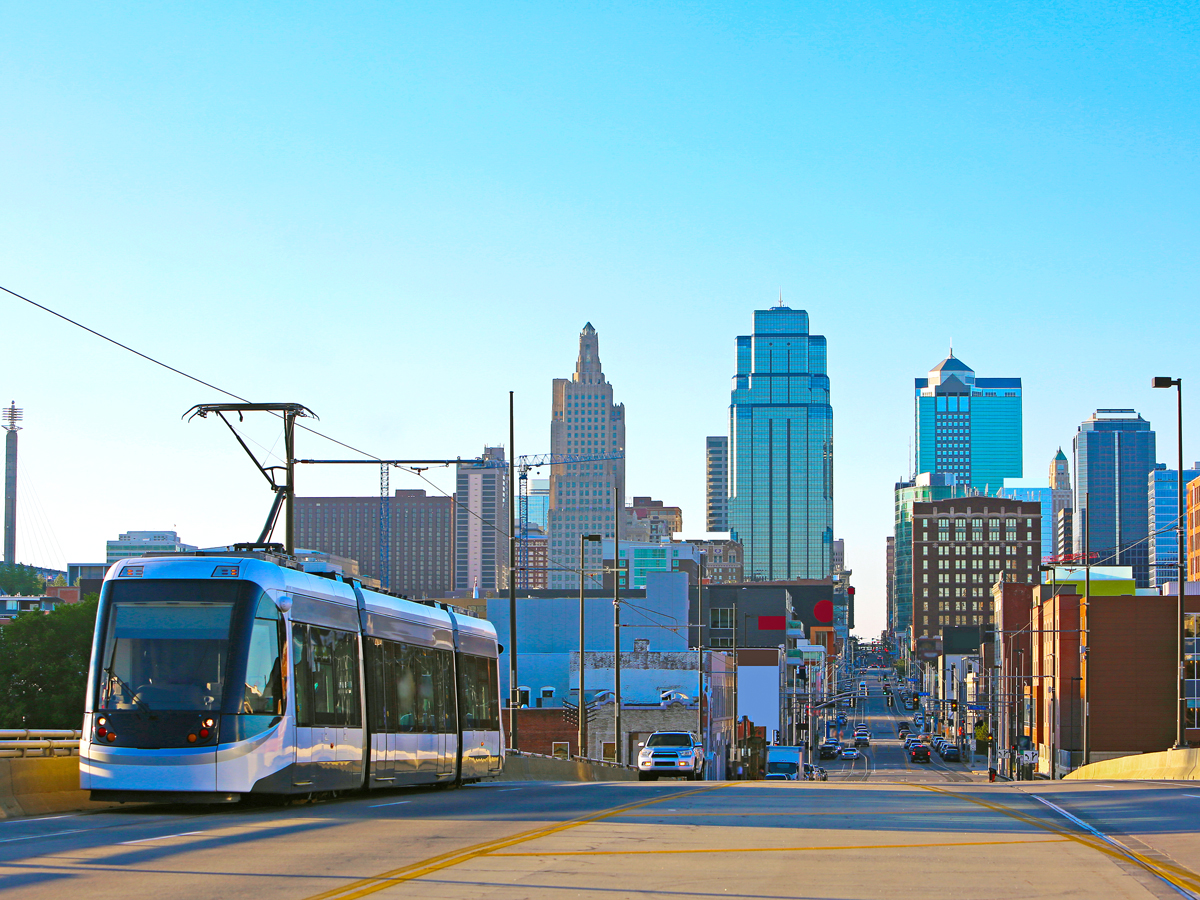 KC Streetcar with Kansas City skyline in background