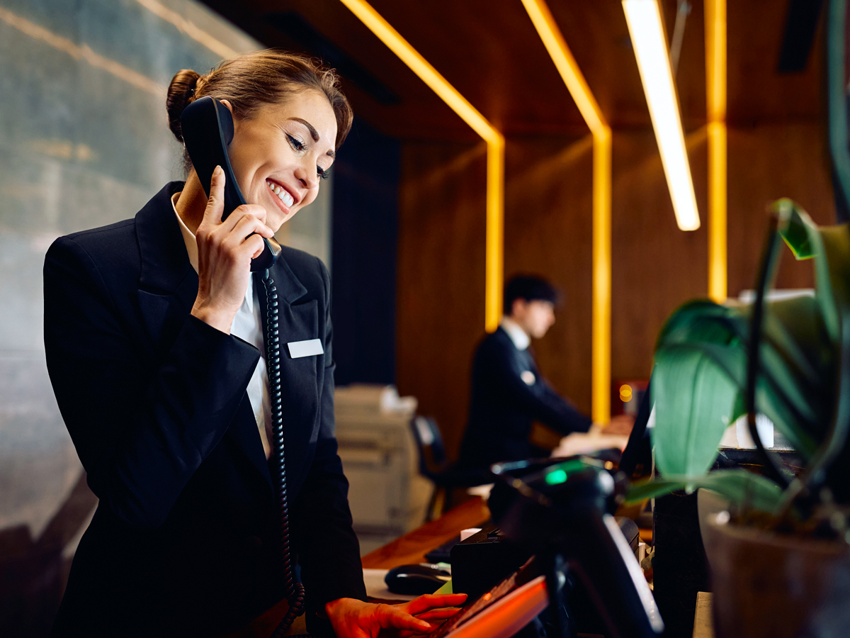 Hotel concierge speaking on phone