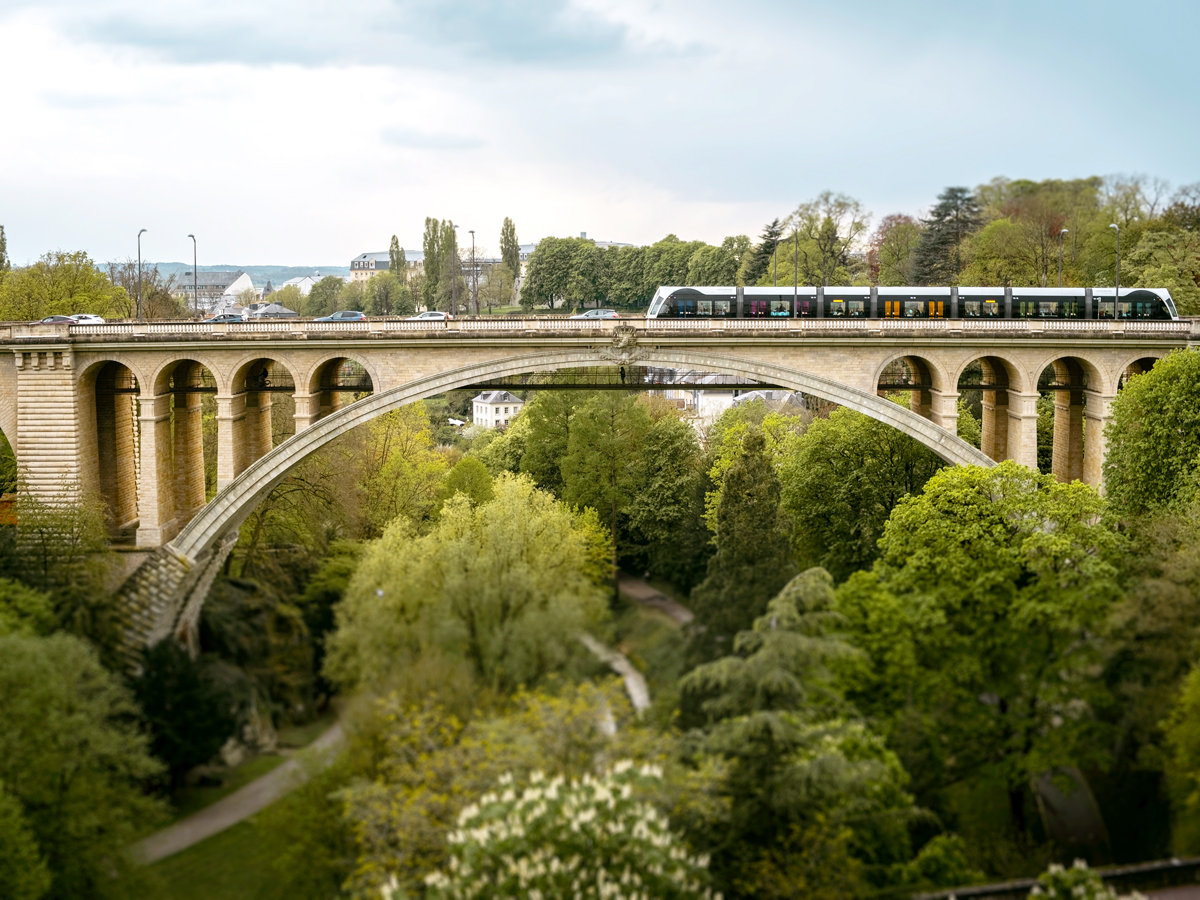 Tram on arched bridge in Luxembourg City