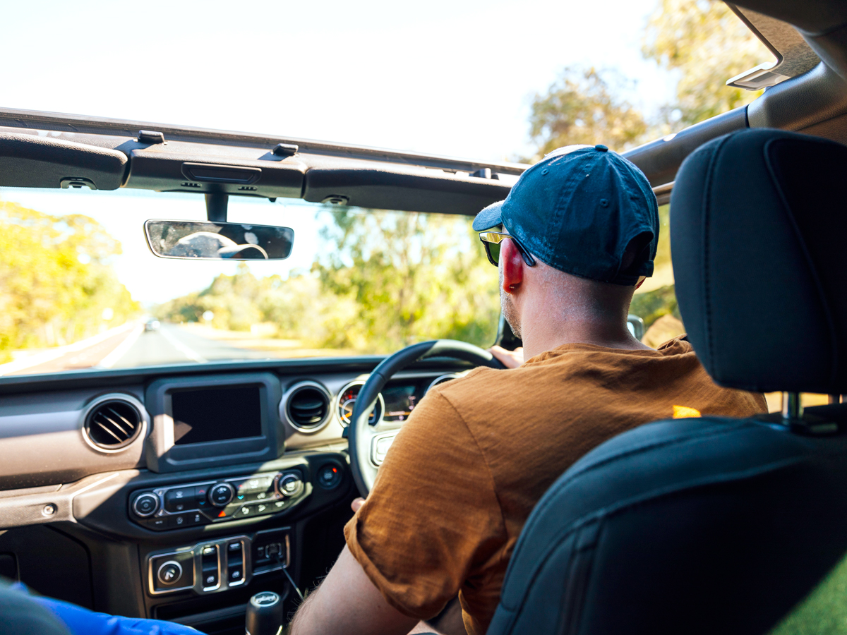 Man driving with top down
