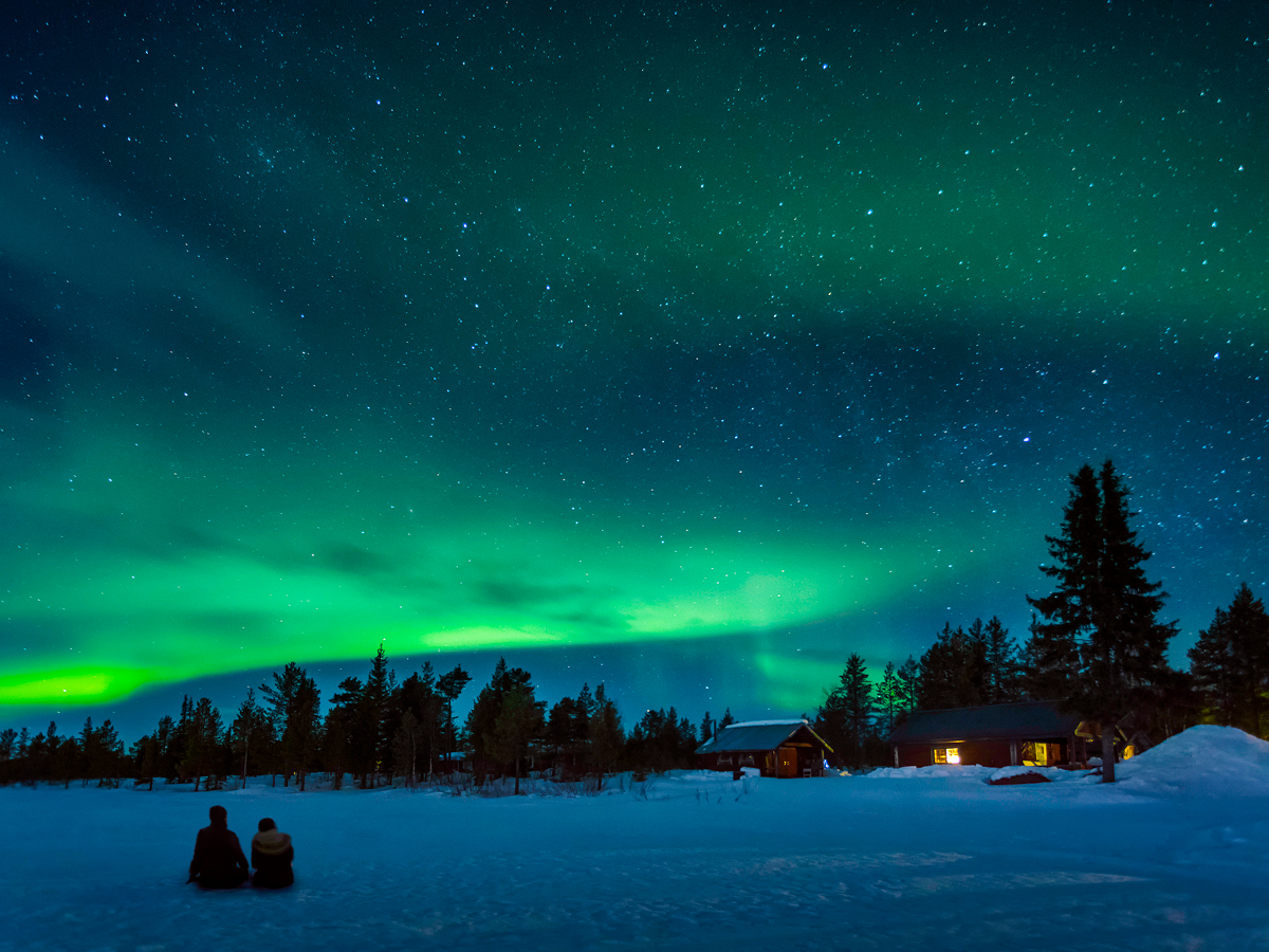 Northern lights over the snowy landscapes of Lapland, Sweden