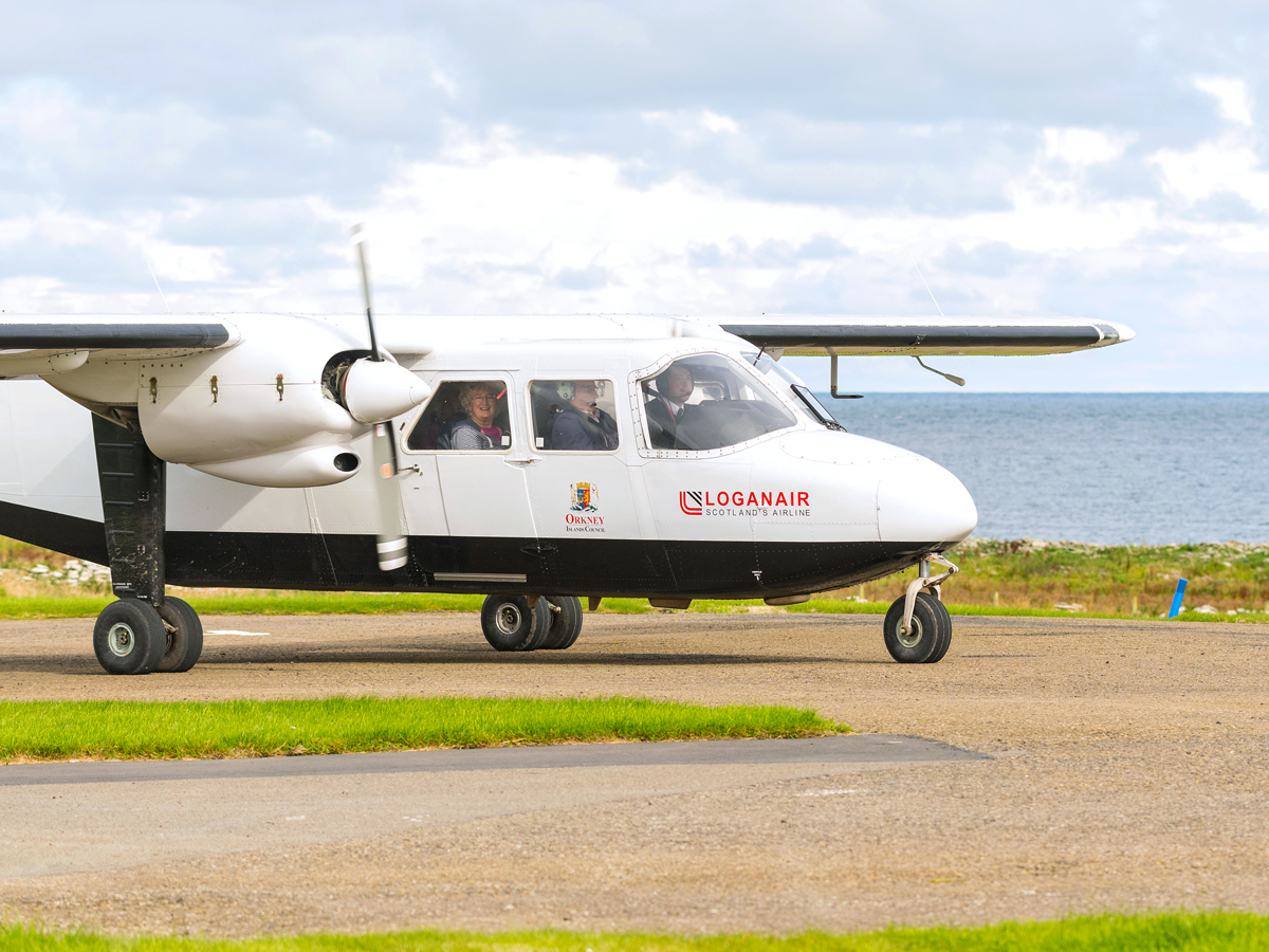 Loganair aircraft taxiing at Westray Airport in Scotland