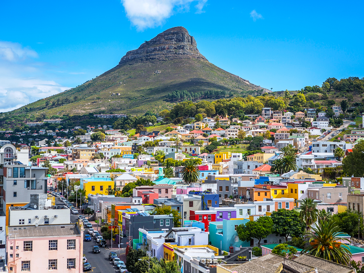 Table Mountain looming over colorful architecture of Cape Town, South Africa