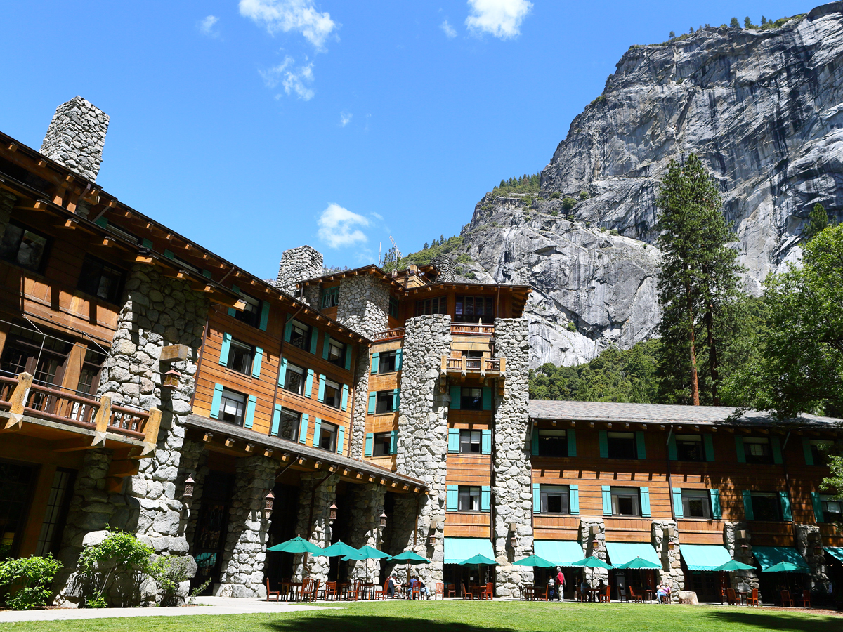 The Ahwahnee hotel framed by mountains of Yosemite National Park in California