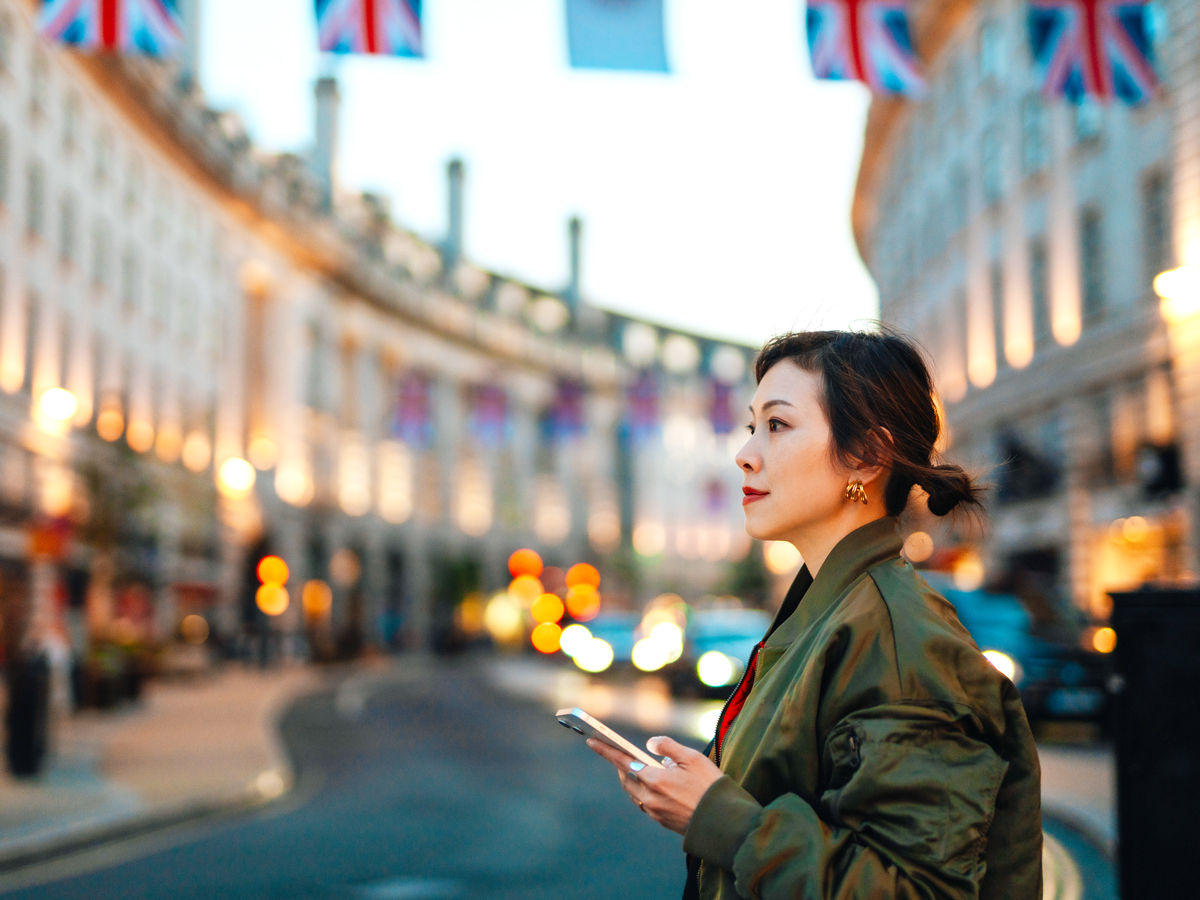 Tourist using phone to navigate city