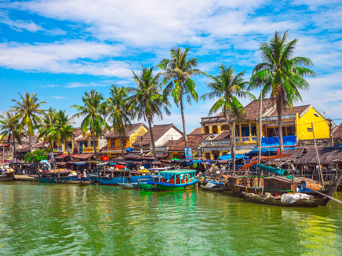 Boats docked along Thu Bon River in Hoi An, Vietnam