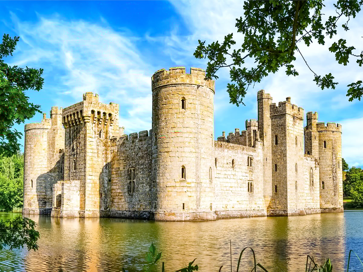 Ruins of Bodiam Castle surrounded by moat in East Sussex, England