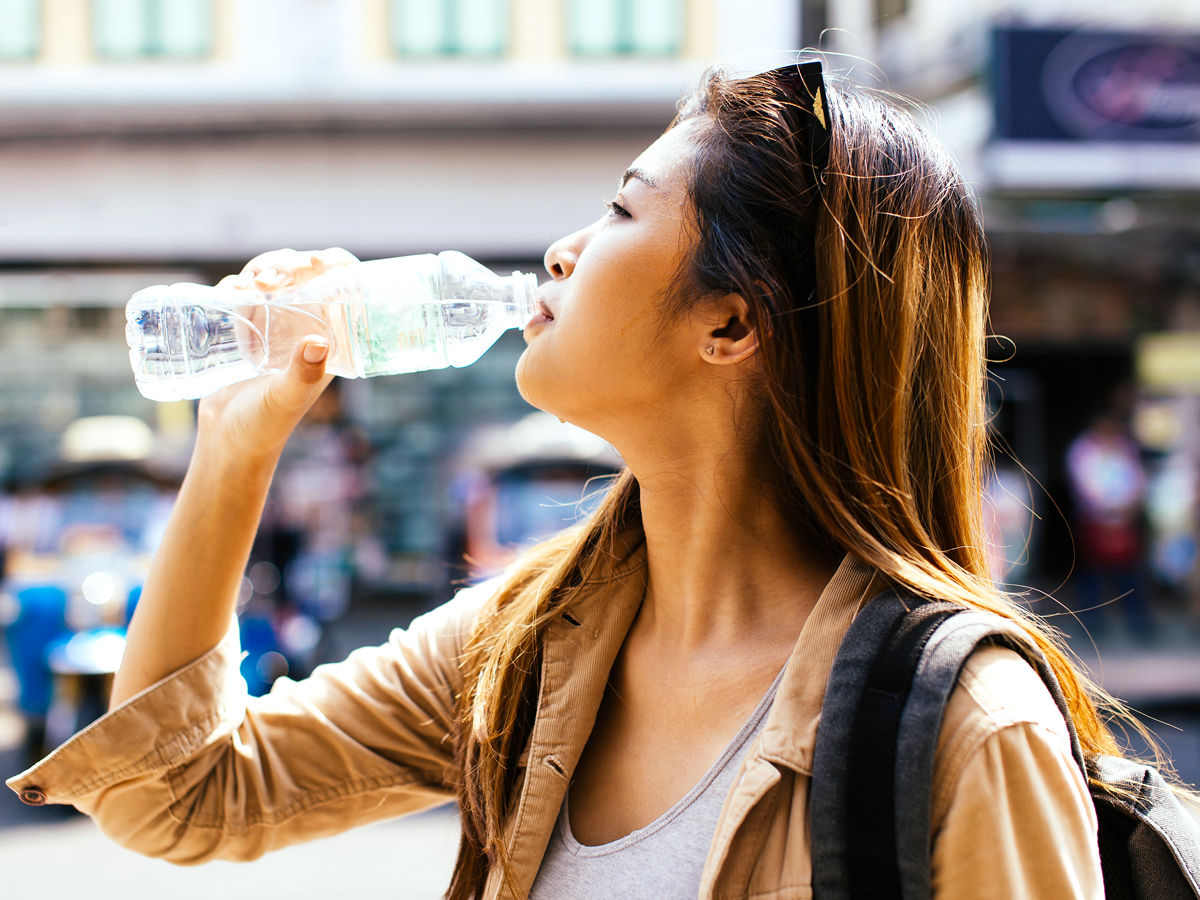 Woman drinking bottled water