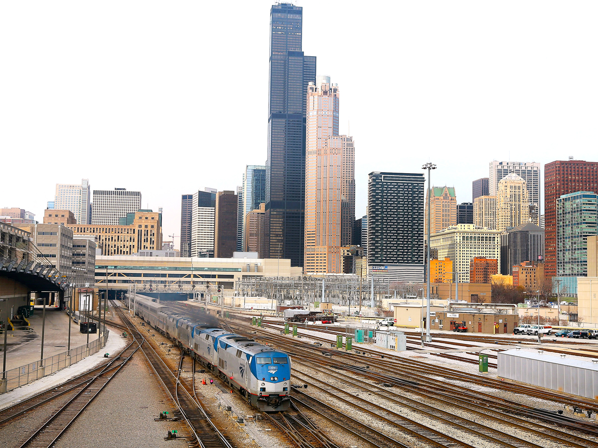Amtrak train with Chicago skyline in background