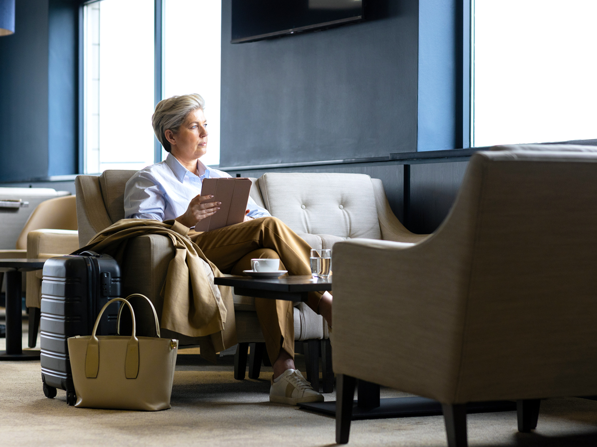 Traveler sitting in airport lounge