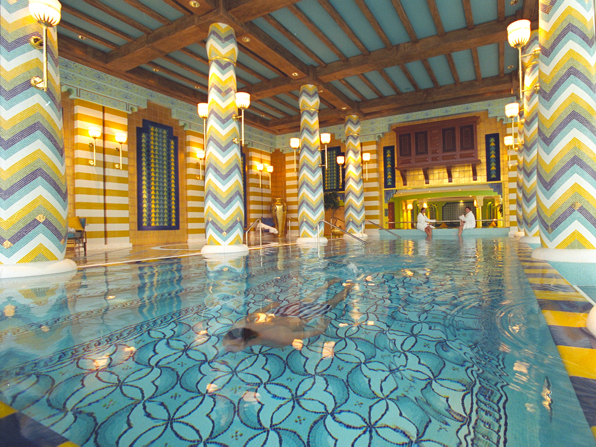 Guest swimming in luxe pool at the Jumeirah Burj Al Arab hotel in Dubai