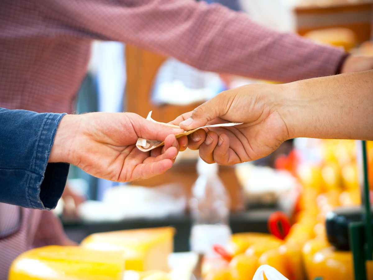 Customer handing over cash payment