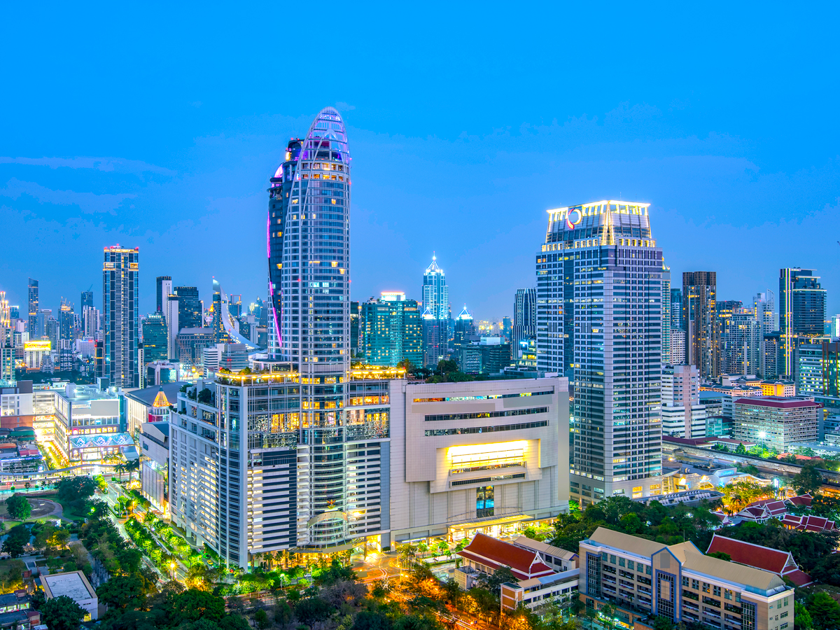 Centara Grand at CentralWorld above Bangkok skyline at night