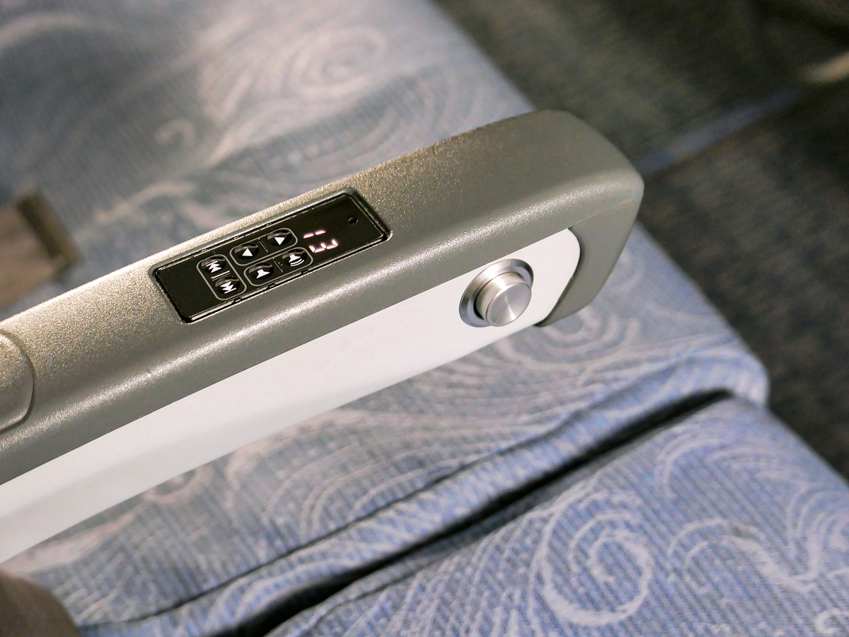 Close-up view of airplane armrest