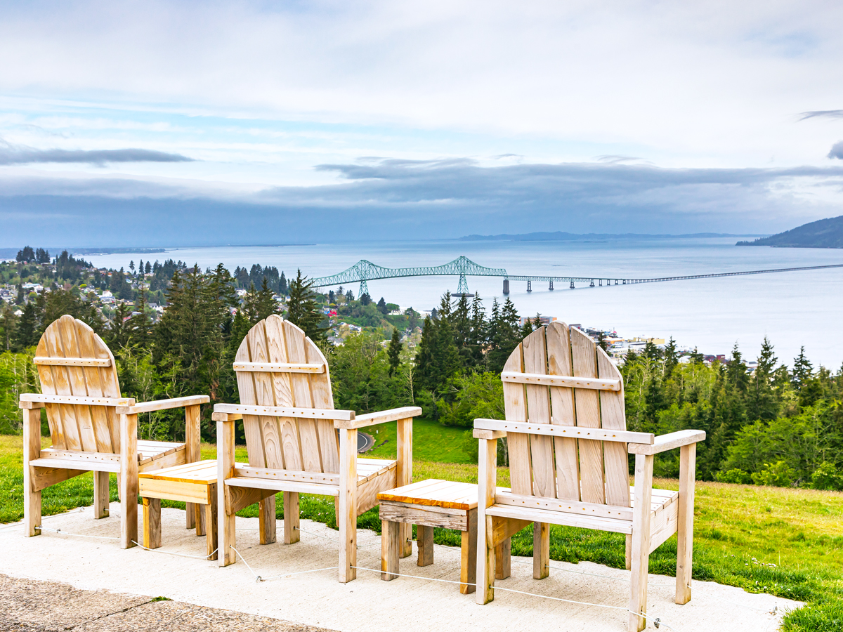 Chairs on hill overlooking the coast of Astoria, Oregon