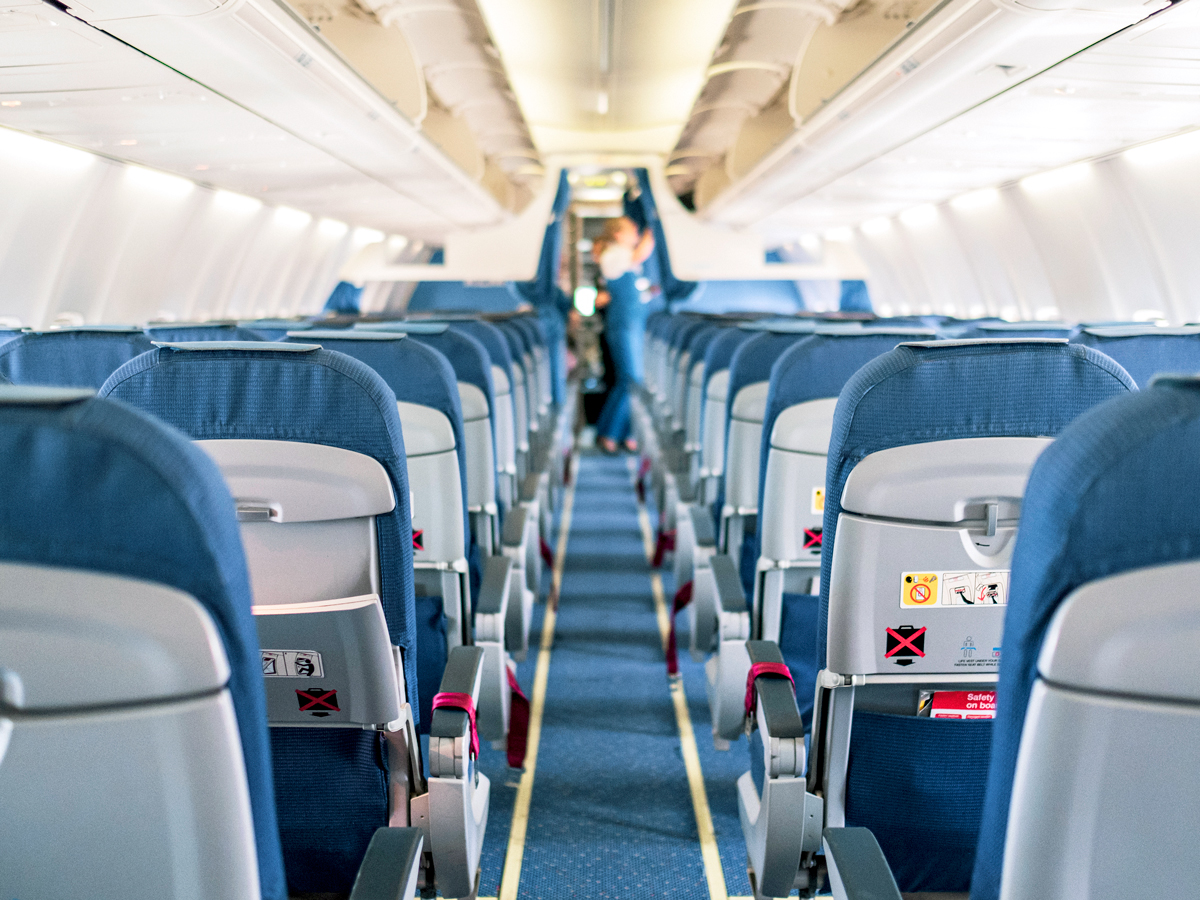 View of empty airplane cabin from back to front