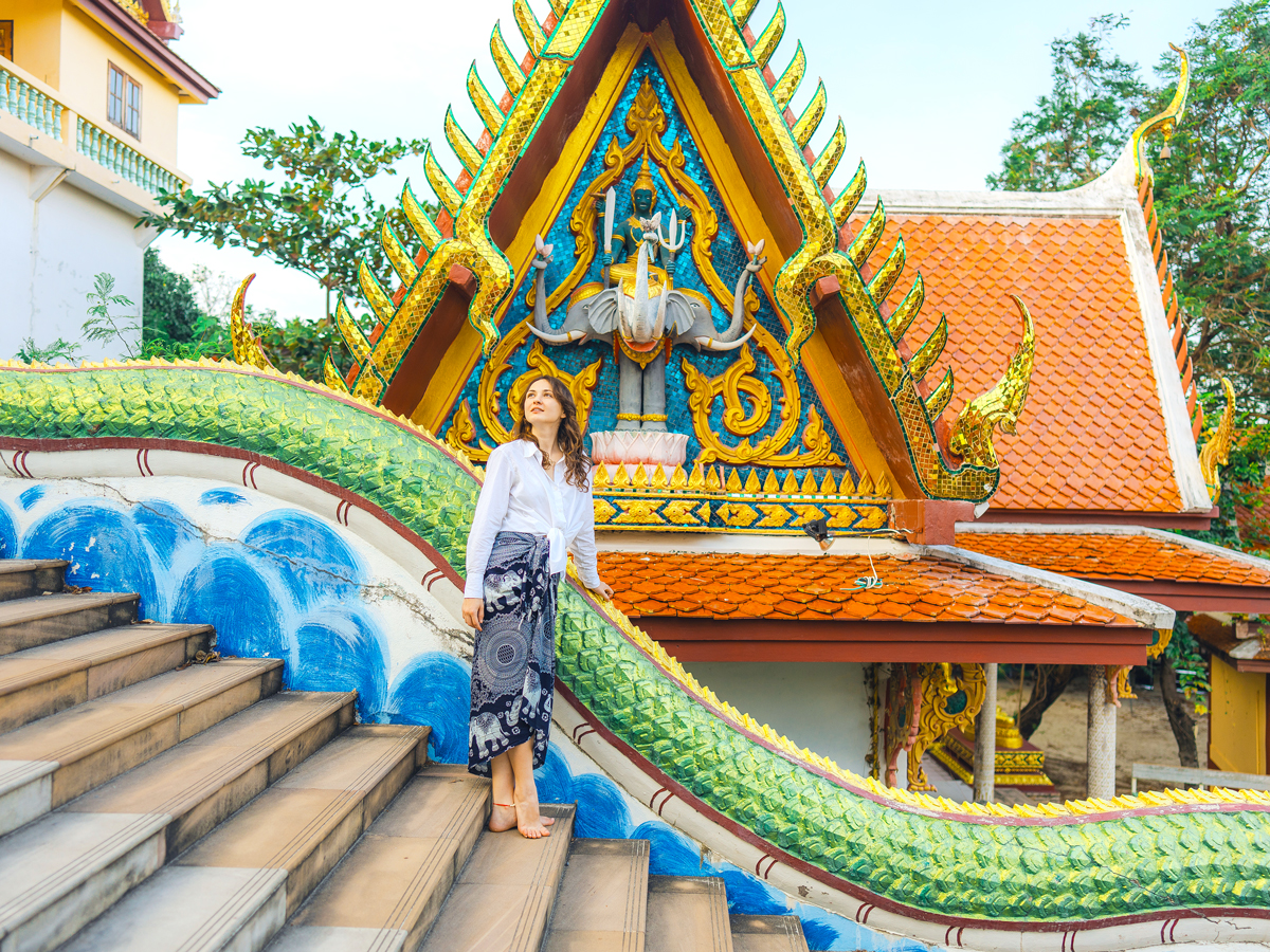 Woman standing outside of Thai temple