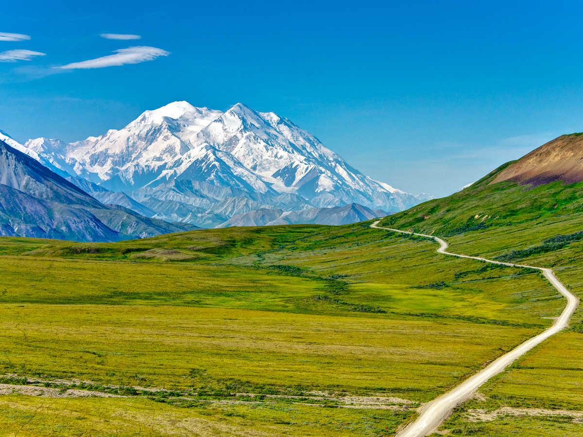 Road leading to snow-covered peak of Denali in Alaska