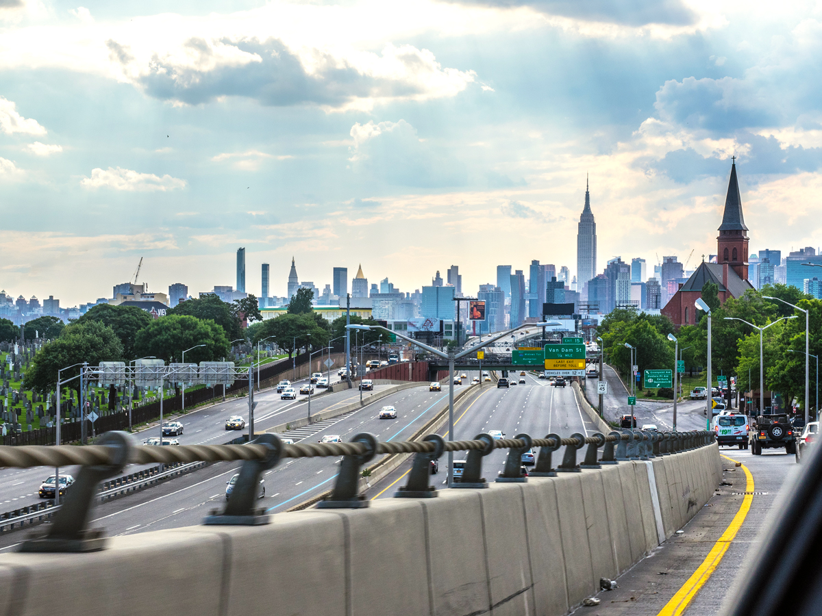 Highway onramp with view of Manhattan skyline