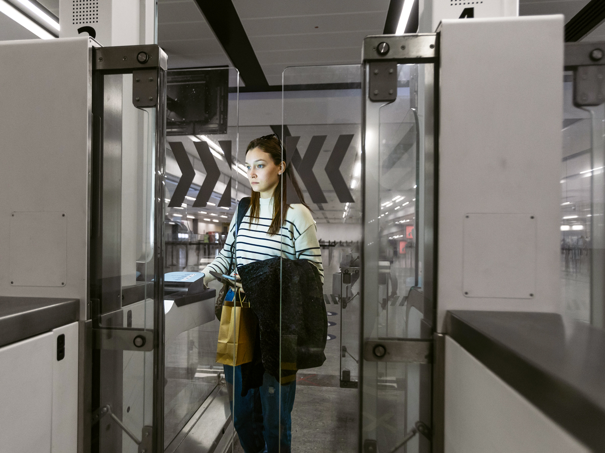 Traveler using automatic border control checkpoint