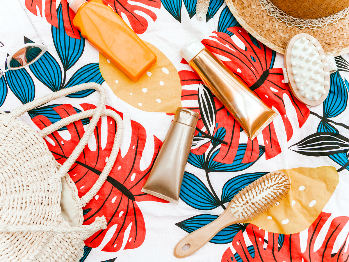 Various toiletries on bedspread