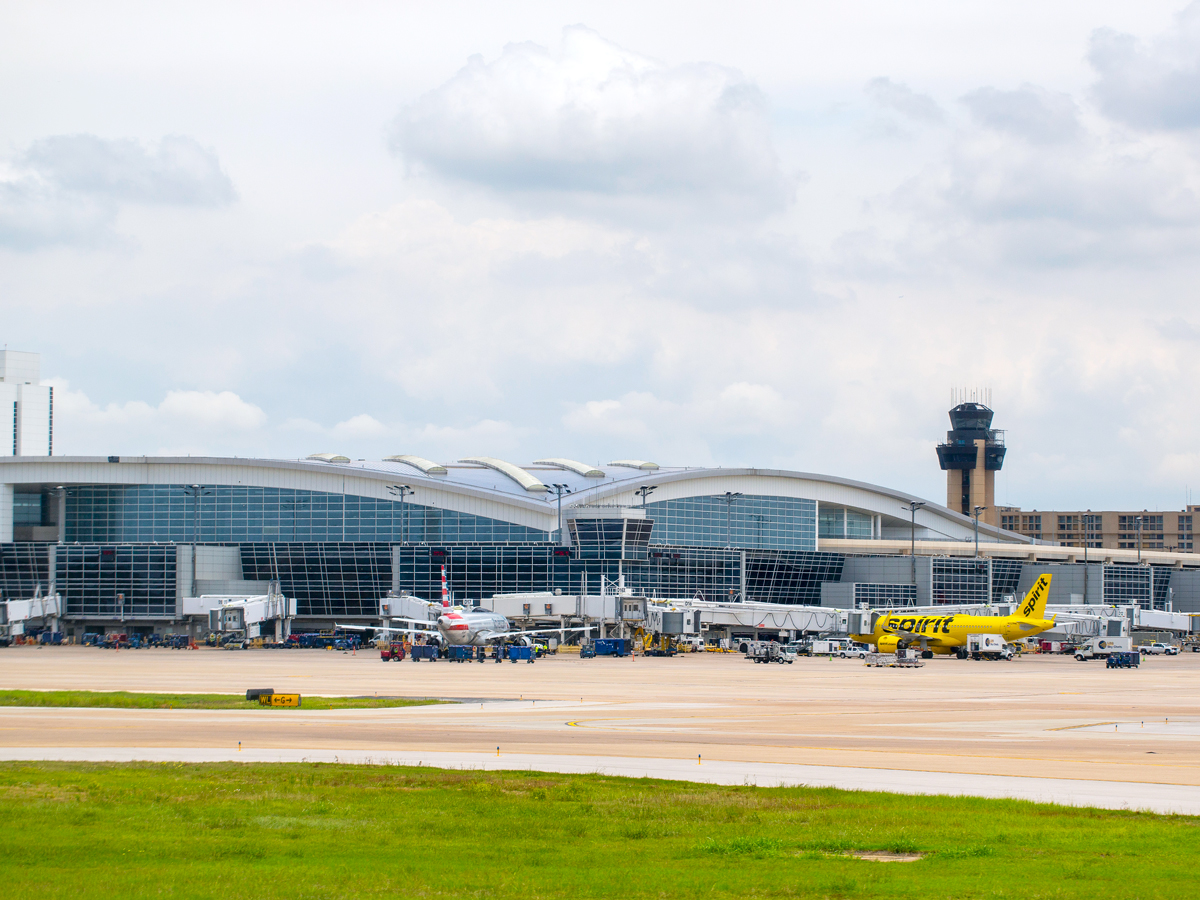 Aircraft parked at terminal at Dallas/Fort Worth International Airport